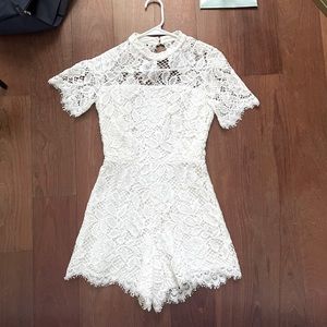 Alexis White lace romper with open back detail
